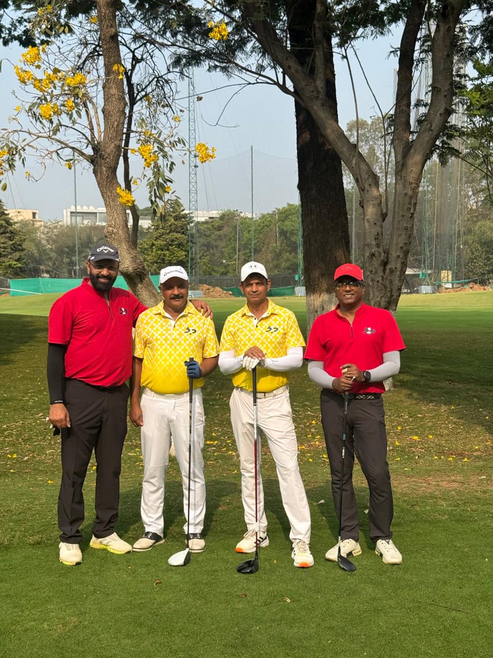 Govind Raj with three playing partners on a golf course