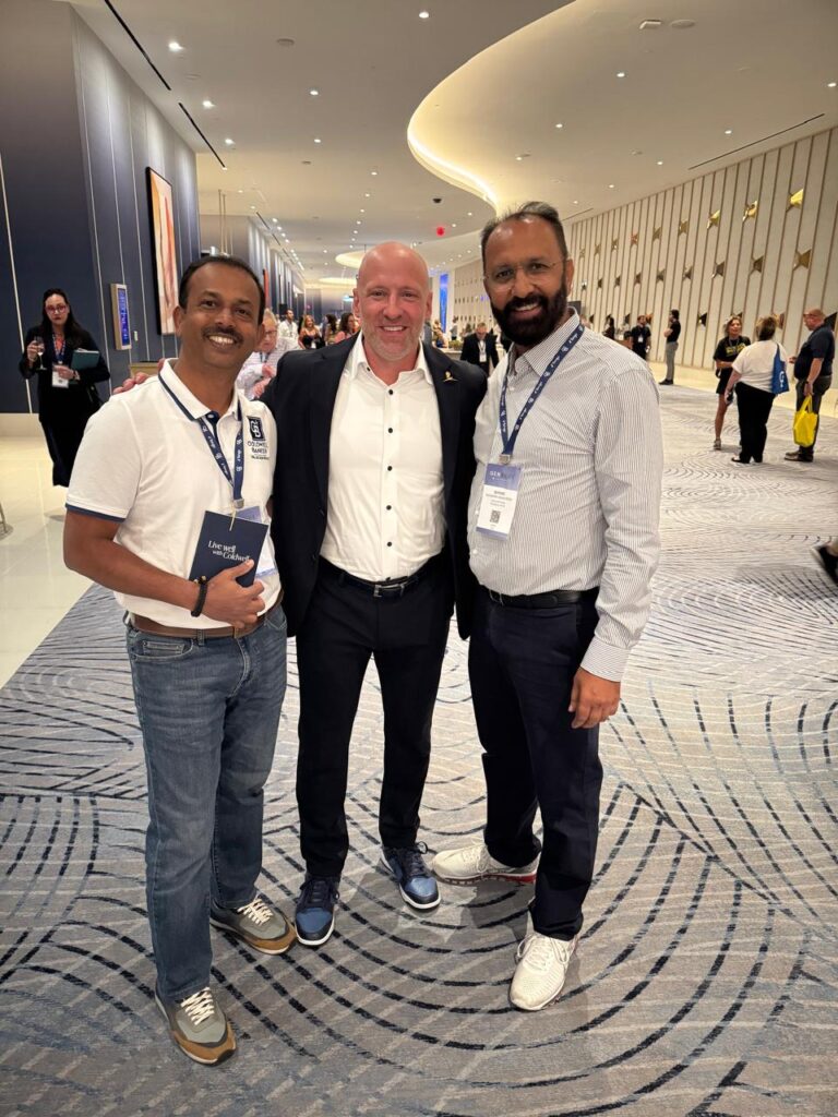 Govind Raj with colleagues and Coldwell Banker leadership at a conference