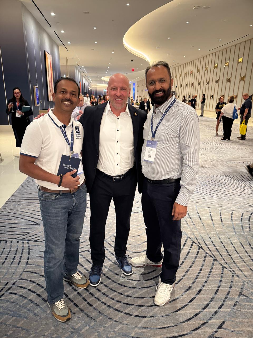Govind Raj with colleagues and Coldwell Banker leadership at a conference